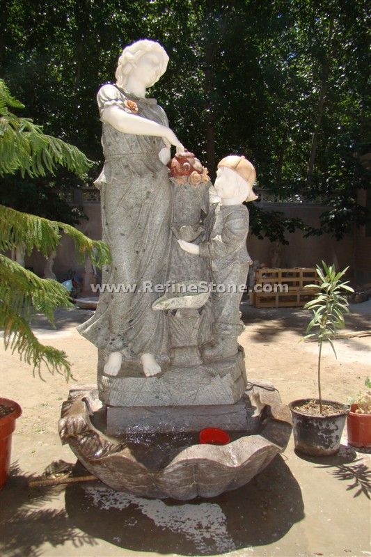 Lady and child stone water fountain