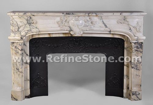 large antique regence style fireplace made of seravezza marble finely carved